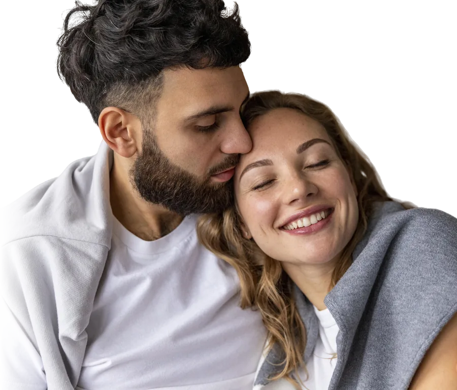 A smiling couple embracing, looking forward to a brighter tomorrow
